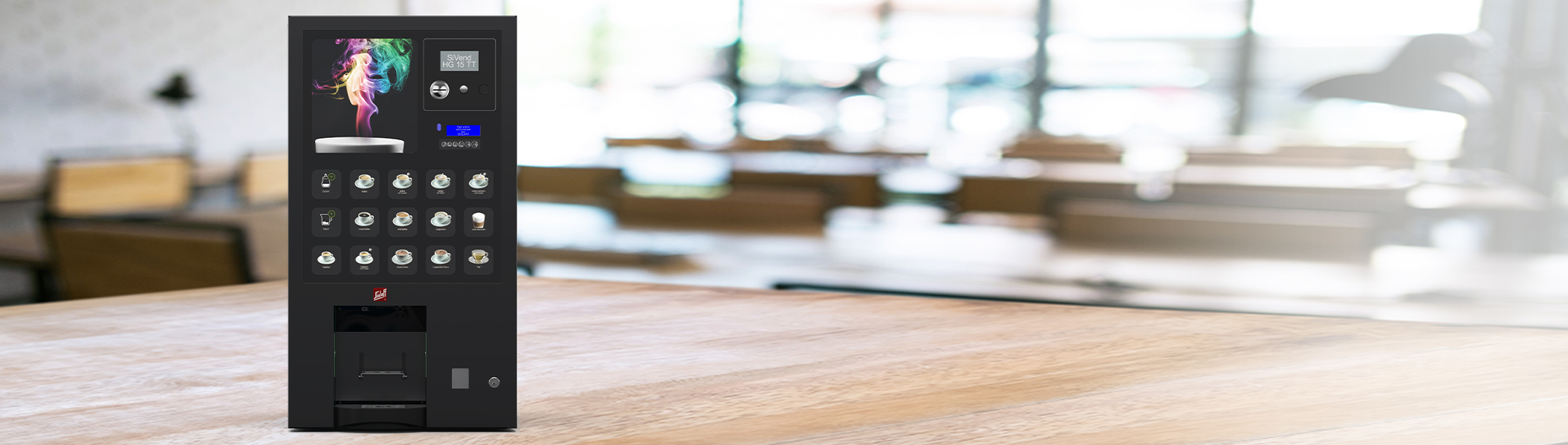 SiVend HG 15 TT Der Heißgetränkeautomat SiVend HG 15 TT auf einem großen Holztisch